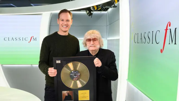 Dan Walker presents Sir Karl Jenkins with a gold disc to celebrate his No.1 entry in the Classic FM Hall of Fame 2026. Picture: Classic FM